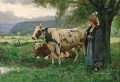 vacas y campesina